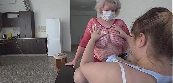  A girlfriend with a strapon fucks a mature lesbian in a red outfit. Her juicy PAWG and big tits are sexually shaking.